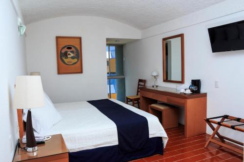 Кровать или кровати в номере Hotel Calli