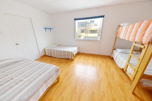 Cama o camas de una habitación en Punta Huanchaco Hostel