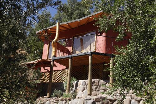a house on top of a pile of rocks at Tres Continentes in San José de Maipo