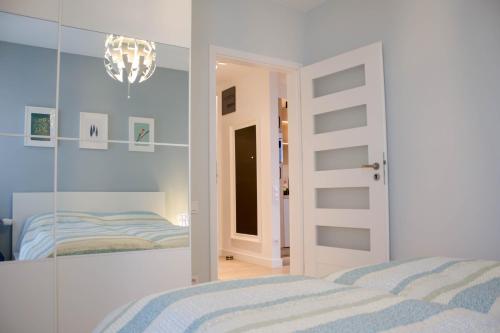 Ένα ή περισσότερα κρεβάτια σε δωμάτιο στο Apartamenty Rynek w samym centrum Ustronia - Dream Apart