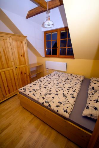 a bedroom with a bed in a room at Apartmaji Lajf in Kranjska Gora