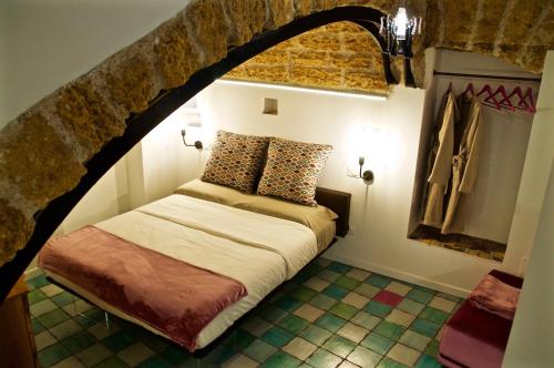 מיטה או מיטות בחדר ב-Sicily in Villas - Al Garaf in centro