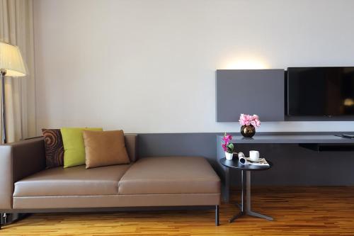 a living room with a couch and a table at Midori Clark Hotel and Casino in Clark