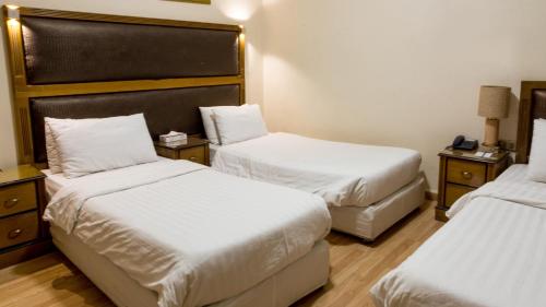 Cama o camas de una habitación en Aghadeer Hotel
