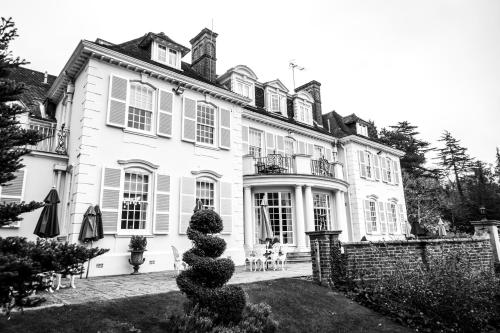 a black and white photo of a house at Gorse Hill Hotel in Woking