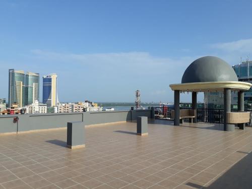 a building with a dome on the roof at Chelsea Hotel in Dar es Salaam