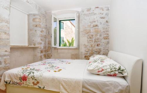 a bedroom with a bed and a window at M.A.S. in Supetar