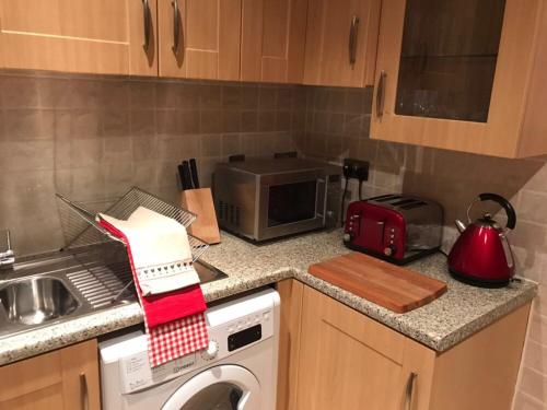 Una cocina o zona de cocina en Finchley Apartment