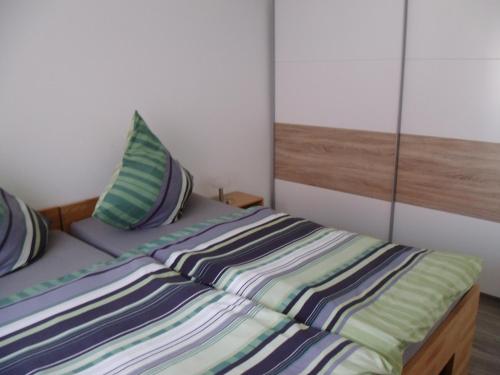 Ένα ή περισσότερα κρεβάτια σε δωμάτιο στο Martini Pension Rammert Ferienwohnung