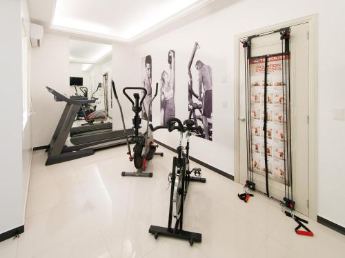 a gym with exercise bikes and a treadmill at Grand Hotel Tepatitlán in Tepatitlán de Morelos