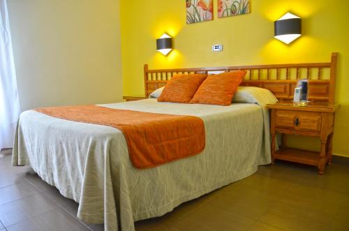 Ένα ή περισσότερα κρεβάτια σε δωμάτιο στο Hotel La Colina