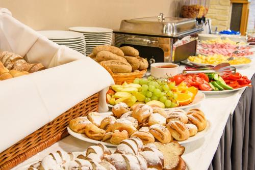 a buffet with different types of food on a table at Apartmán NA SVAHU 3+KK, Dolní Morava in Dolní Morava