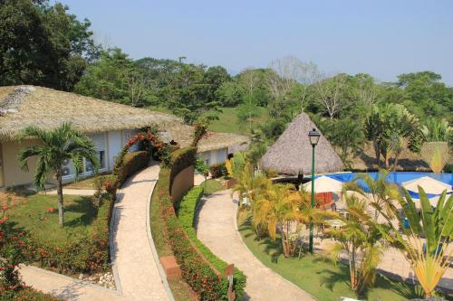 an aerial view of a resort with a swimming pool at Hotel Villa Mercedes Palenque in Palenque