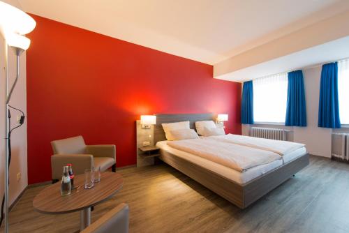 
Ein Bett oder Betten in einem Zimmer der Unterkunft Hotel Westermann
