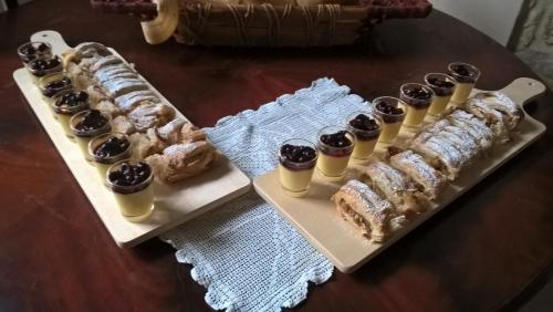 a tray of pastries and cupcakes on a table at Antica Taverna del Principe in Sepino