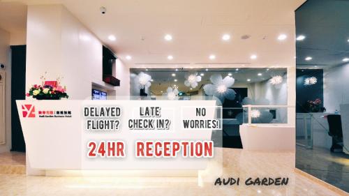 a room with a sign that says zir reception at Audi Garden Business Hotel in Taoyuan