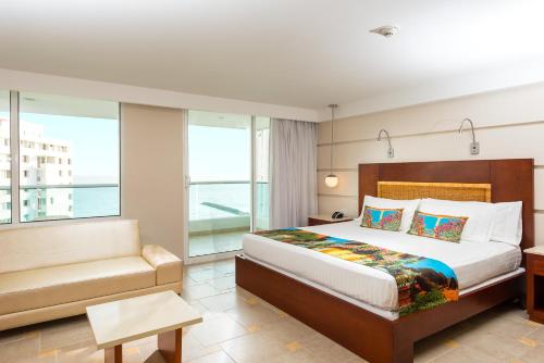 Postel nebo postele na pokoji v ubytování Hotel Dann Cartagena