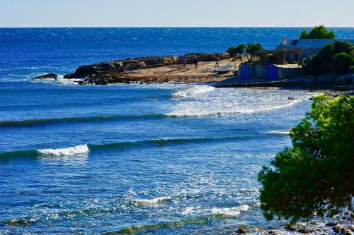 a view of a body of water with waves at Villa Isla Bonita in Sa Ràpita