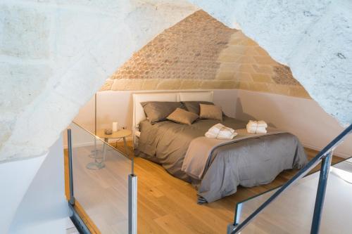 Cama ou camas em um quarto em Borgorosa Dimora In Puglia