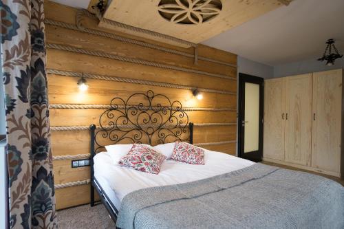 Ένα ή περισσότερα κρεβάτια σε δωμάτιο στο Willa Aspen
