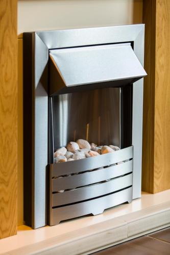 a box of donuts sitting on a shelf at The Artane Self Catering in Dublin