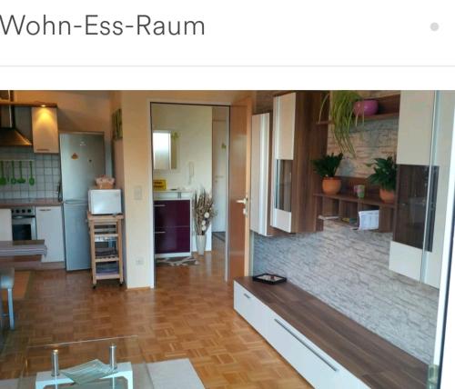 a room with a kitchen and a living room at Fewo Hilde in Annenheim