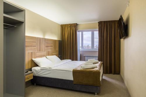 Кровать или кровати в номере Бизнес-отель Воскресенск