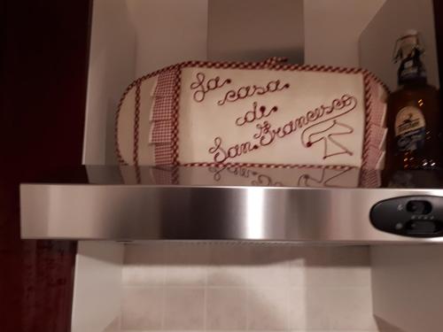 a cake sitting on top of a shelf at La Casa di San Francesco in Assisi