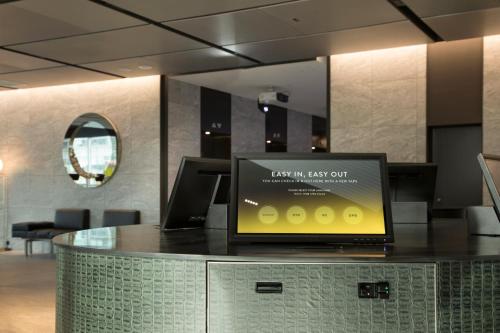 a laptop sitting on a counter in an office at L7 GANGNAM by LOTTE in Seoul
