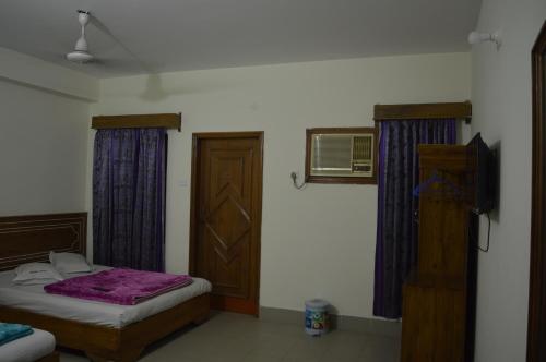 Ένα ή περισσότερα κρεβάτια σε δωμάτιο στο Hotel Quality Home