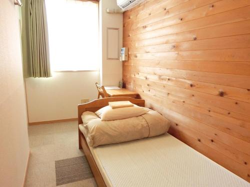 Ένα ή περισσότερα κρεβάτια σε δωμάτιο στο Kencha Rumah