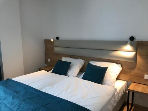 Ένα ή περισσότερα κρεβάτια σε δωμάτιο στο Apartamenty Zieleniec