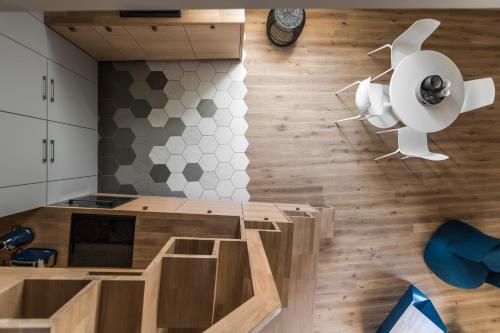 an overhead view of a kitchen with wooden floors at City Entrance Apartment in Vilnius
