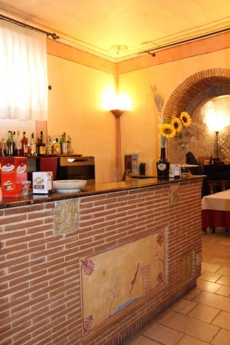 a kitchen with a brick counter with flowers on it at Villa Cosilinum in Padula