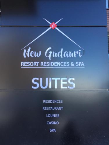 a sign for a new guadalajara resort restaurantresbestos and spa at Zen Apartments Gudauri in Gudauri