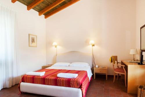 A bed or beds in a room at Agriturismo Valle Galfina