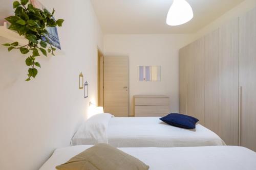 Letto o letti in una camera di The Best Rent - Ripamonti Apartment