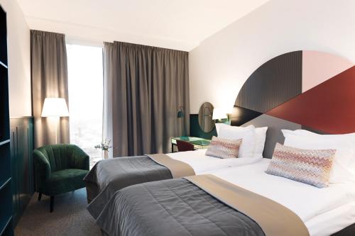 מיטה או מיטות בחדר ב-Elite Hotel Carolina Tower