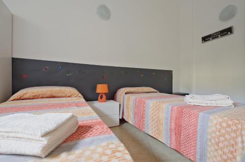 Postelja oz. postelje v sobi nastanitve Bologna Città Turrita Rooms