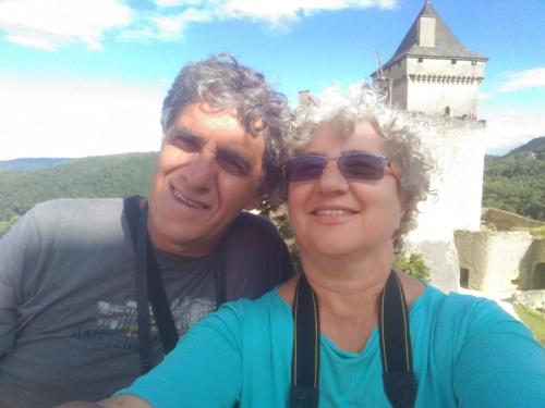 a man and a woman standing in front of a castle at A due passi dal Botteniga in Treviso