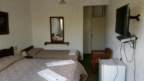 Postel nebo postele na pokoji v ubytování Hotel Yeruti