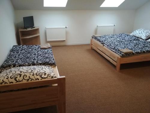 Postel nebo postele na pokoji v ubytování Penzion Pod Kaštany Kvasice