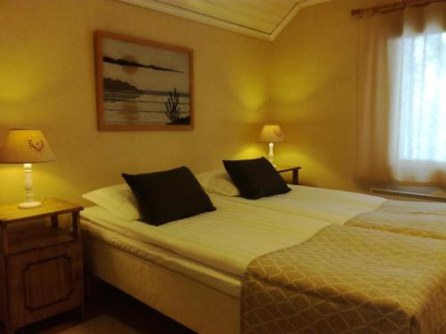 Posteľ alebo postele v izbe v ubytovaní Laiskan Kartano