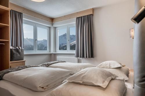 Postel nebo postele na pokoji v ubytování Apartmenthaus Enzian Hochsölden