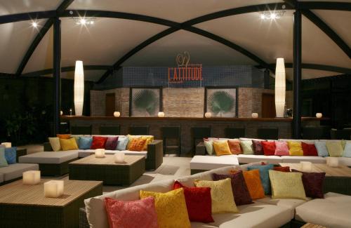 a room filled with lots of pillows and couches at Senator Banus in Estepona