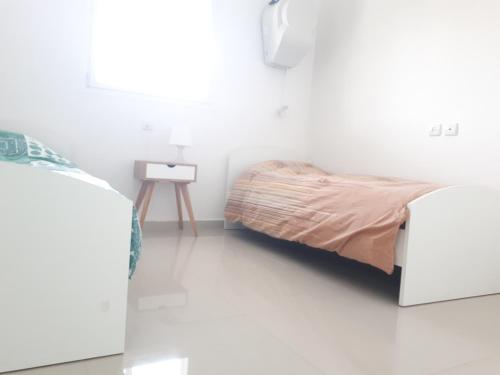 Cama ou camas em um quarto em Shave Tsion Apartment in the center Ashdod