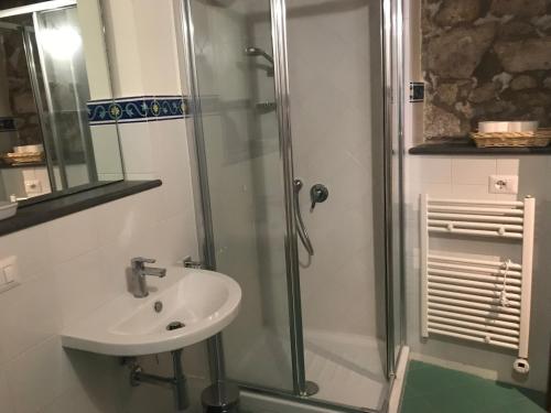 a bathroom with a sink and a shower at Palazzo Urbani in Orvieto
