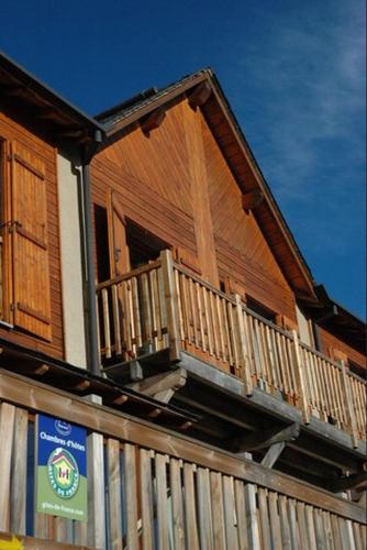 a house with a balcony on the side of it at Chalet l'Angélique in Bolquere Pyrenees 2000