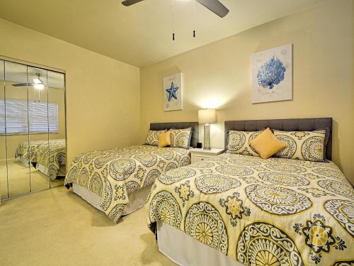a bedroom with two beds and a window at Regatta Beach Club C1009 2373 in Clearwater Beach