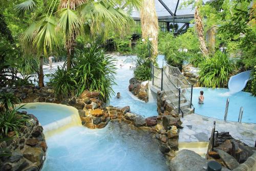 a water slide in a resort with people in it at Center Parcs Heijderbos Limburg-Weeze in Heijen